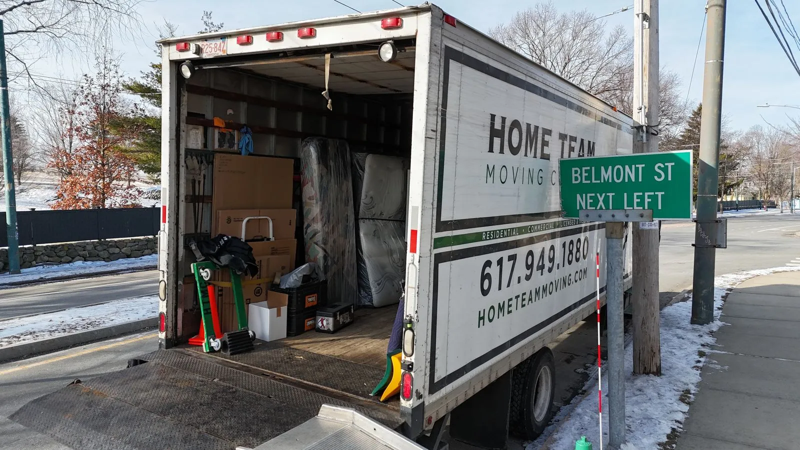 Loaded truck with pads, dollies and wrapped furniture