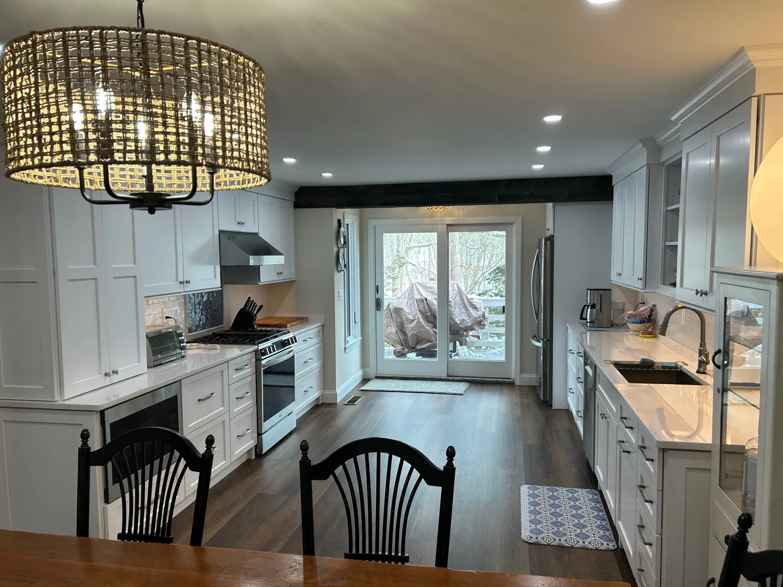 Open kitchen view with black spindle chairs