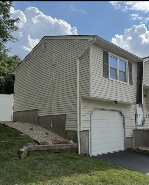 Side exterior of the home before painting