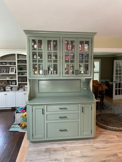 Painted kitchen hutch in Foxboro, the green adds a nice touch of color to the room.
