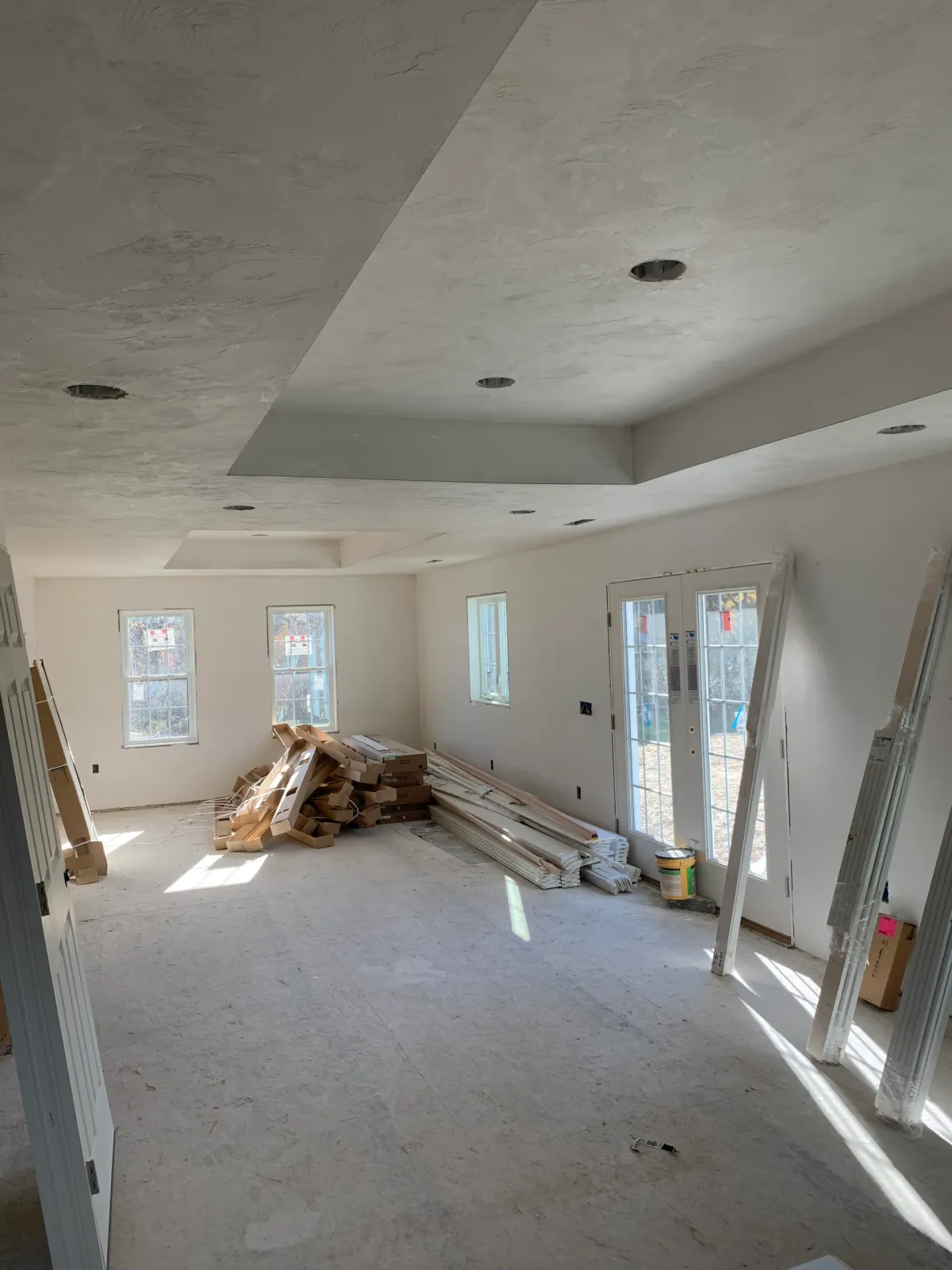 A large room with a lot of windows and a lot of wood in it.