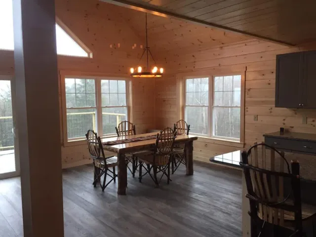 Dining Room With Table And Hanging Light