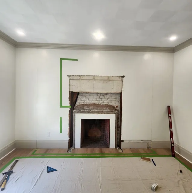 Bare brick chimney with the old mantel removed