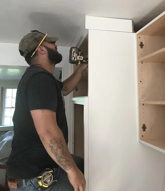 Sardina Custom Remodeling installing custom cabinetry in a MetroWest MA home