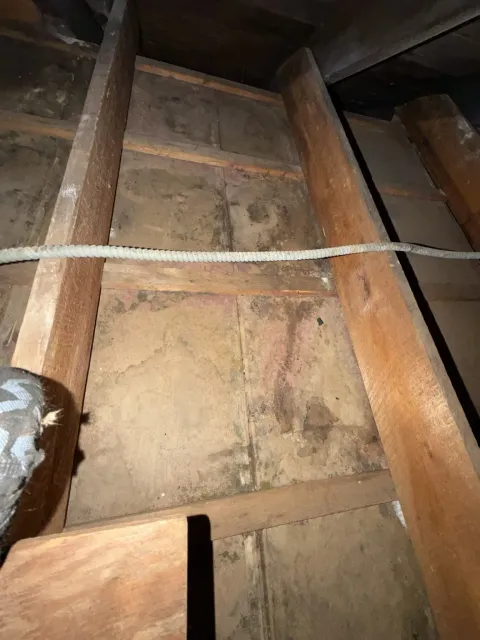 Multiple Sheetrock bays exposed for inspection after removal of the old attic subfloor and insulation during Smithfield Rhode Island mold remediation project
