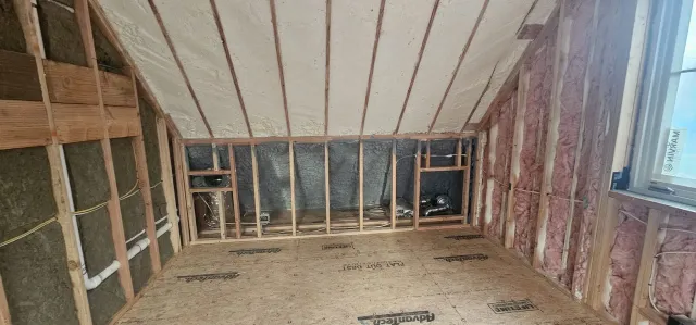 A room with a ceiling that is being built in a house.