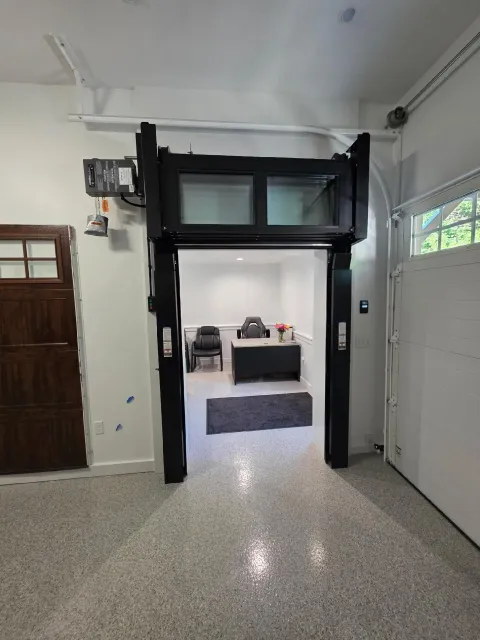 Interior showroom with garage door styles on display.