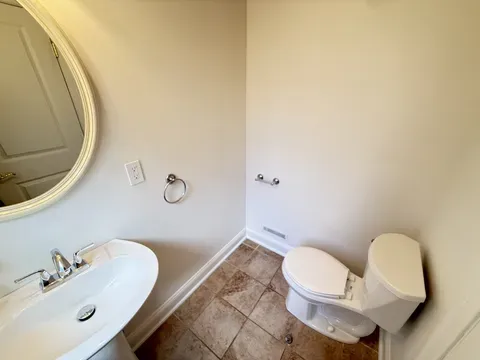 A bathroom with a scrubbed shower and wiped tile