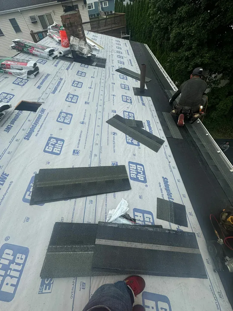 Newly installed asphalt shingle roof on a residential property