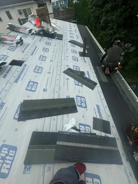 Newly installed asphalt shingle roof on a residential property