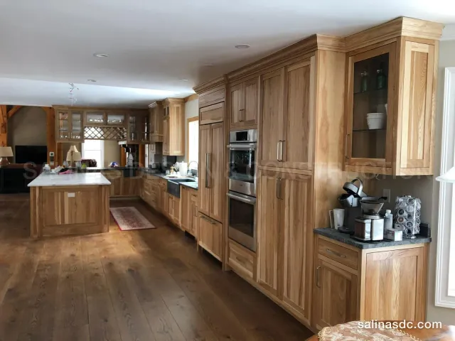 Custom hickory kitchen cabinetry in Southbury, Connecticut: full height cabinets, double wall ovens and an island