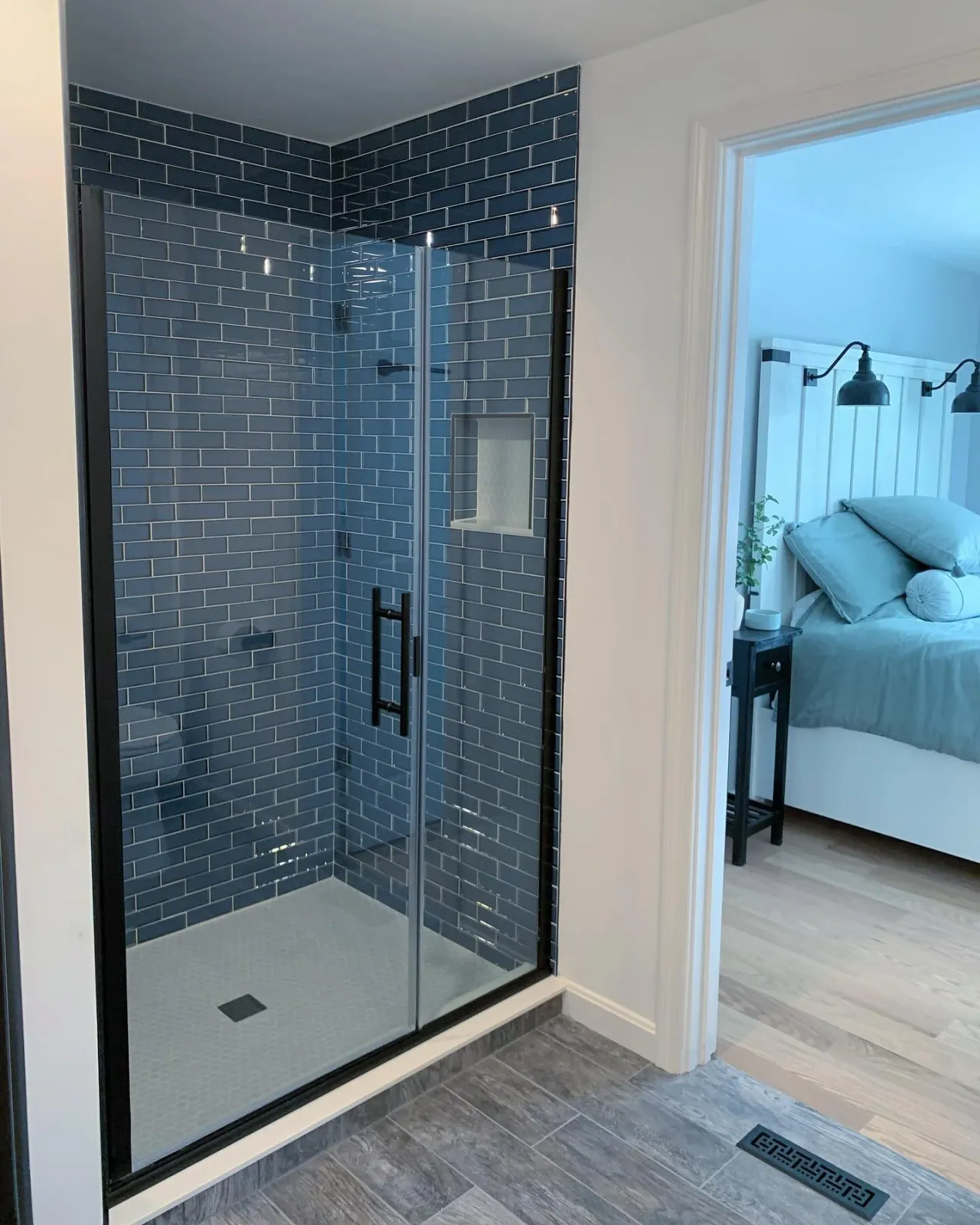 We LOVE how this bathroom came together as part of our #groton addition. The clients really wanted to add to the space and give the whole room a face lift&hellip;so we turned the laundry closet into a gorgeous glass-tiled shower stall and switched ov
