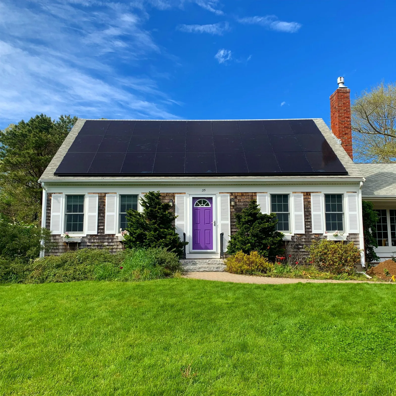 Solar panels installed across the roof of a home in Sandwich, MA