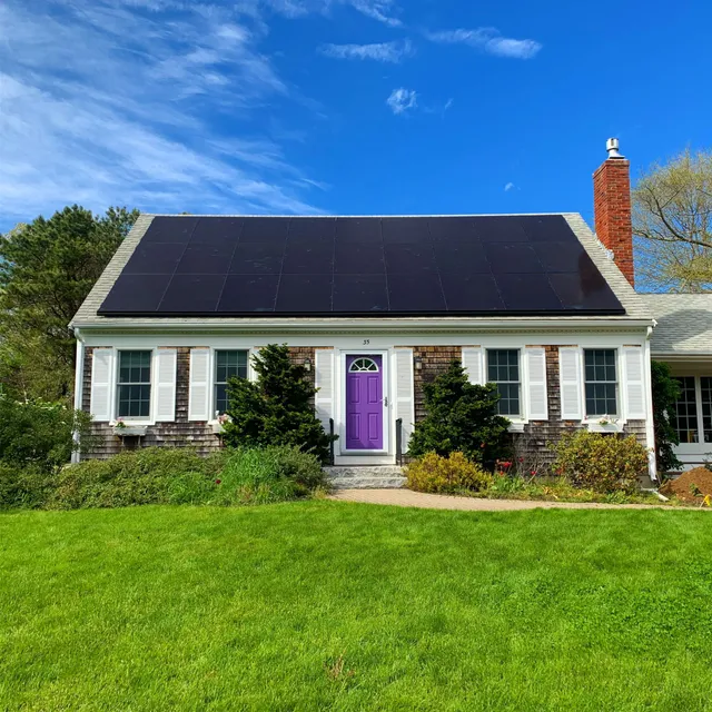Solar panels installed across the roof of a home in Sandwich, MA
