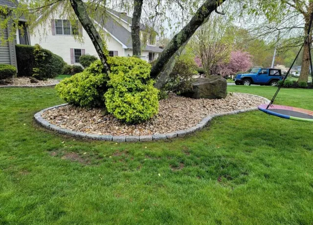 Landscaped Garden Bed with Decorative River Stones
