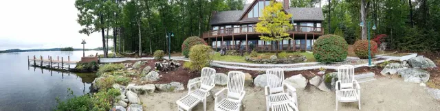 Guests enjoying a broad lakeside patio and deck