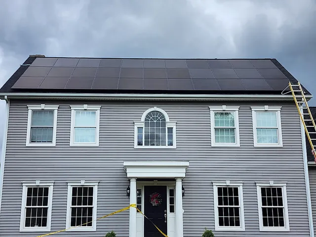 Solar panel installation on colonial home - close up