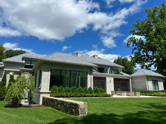 Chilton Development luxury stone custom home side and rear view