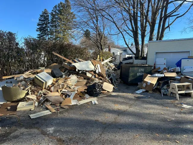 construction debris removal Rhode Island crew loading a job site in Providence