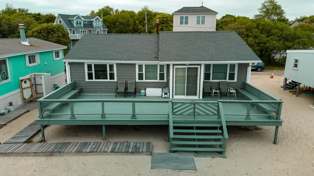 Never before offered for sale.  This home is a rare generational ocean front home, deeded beach, magnificent views, watch the boats pass by into New Bedford Harbor. The deck runs along the entire back of the home, allowing ability for great entertaining. Home has been renovated, newer windows, electrical, roof.  This is the perfect get away from it all.  Have your morning coffee, watching Buzzards Bay boating, picnic on the beach, outdoor shower, listen to the waves at night.  If this isn't enough, you are minutes away from wonderful dining on the waterfront in downtown New Bedford. The views absolutely cannot be duplicated.  Do not miss your chance to live the dream.  Catch the train from New Bedford, jump on the highway to Boston, catch the ferry to MV or Nantucket.  Air service soon to Boston from New Bedford. The property has an inward-westward facing ocean exposure.  This home could also be rented out during summer months.  Ocean homes are rare indeed, and this one is a pearl