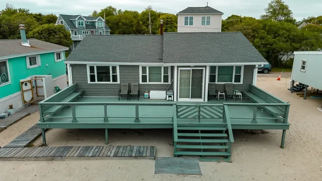 Never before offered for sale.  This home is a rare generational ocean front home, deeded beach, magnificent views, watch the boats pass by into New Bedford Harbor. The deck runs along the entire back of the home, allowing ability for great entertaining. Home has been renovated, newer windows, electrical, roof.  This is the perfect get away from it all.  Have your morning coffee, watching Buzzards Bay boating, picnic on the beach, outdoor shower, listen to the waves at night.  If this isn't enough, you are minutes away from wonderful dining on the waterfront in downtown New Bedford. The views absolutely cannot be duplicated.  Do not miss your chance to live the dream.  Catch the train from New Bedford, jump on the highway to Boston, catch the ferry to MV or Nantucket.  Air service soon to Boston from New Bedford. The property has an inward-westward facing ocean exposure.  This home could also be rented out during summer months.  Ocean homes are rare indeed, and this one is a pearl