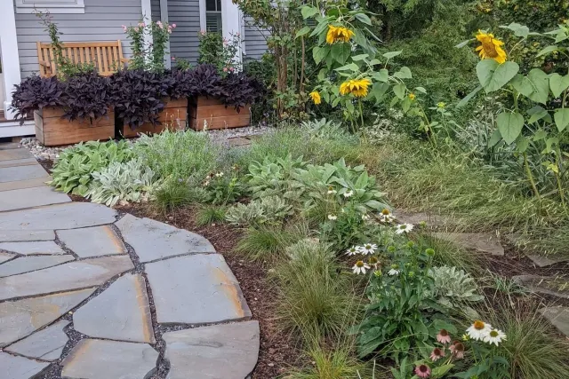 Phase 1 front yard gardens in Burlington, VT. Stone by Champlain Landworks. Bespoke garden containers by Bryan Miller.