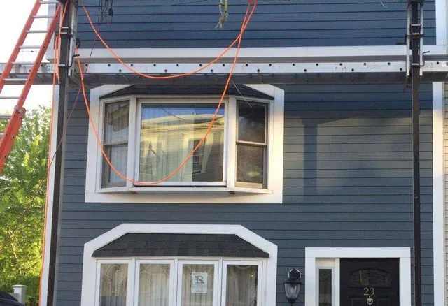 Exterior siding and window trim work