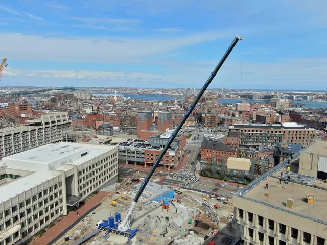 CJ Shaughnessy crane working over a downtown Boston job site