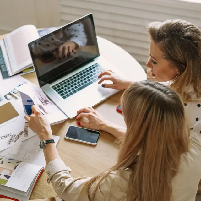 Homeowners reading books and web articles about home remodeling