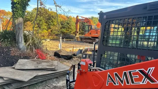 AMEX excavator at an autumn construction site