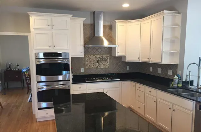 Inside of new two-story family room addition open to kitchen.