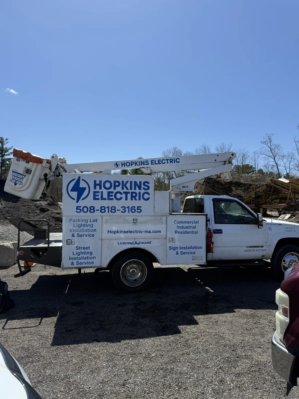 Hopkins Electric service vehicle on a mini split installation job site in Taunton, MA