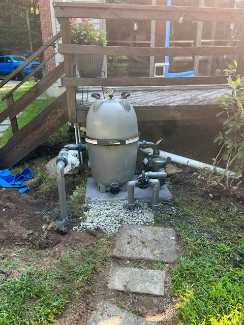 Brand new DE filter installed on concrete pad — equipment upgrade complete