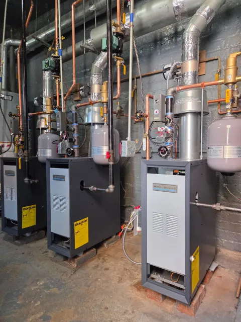 Genesis multi-boiler heating installation with copper piping and system components