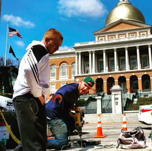 Dom Schiarizzi masonry contractor working in front of Boston State House