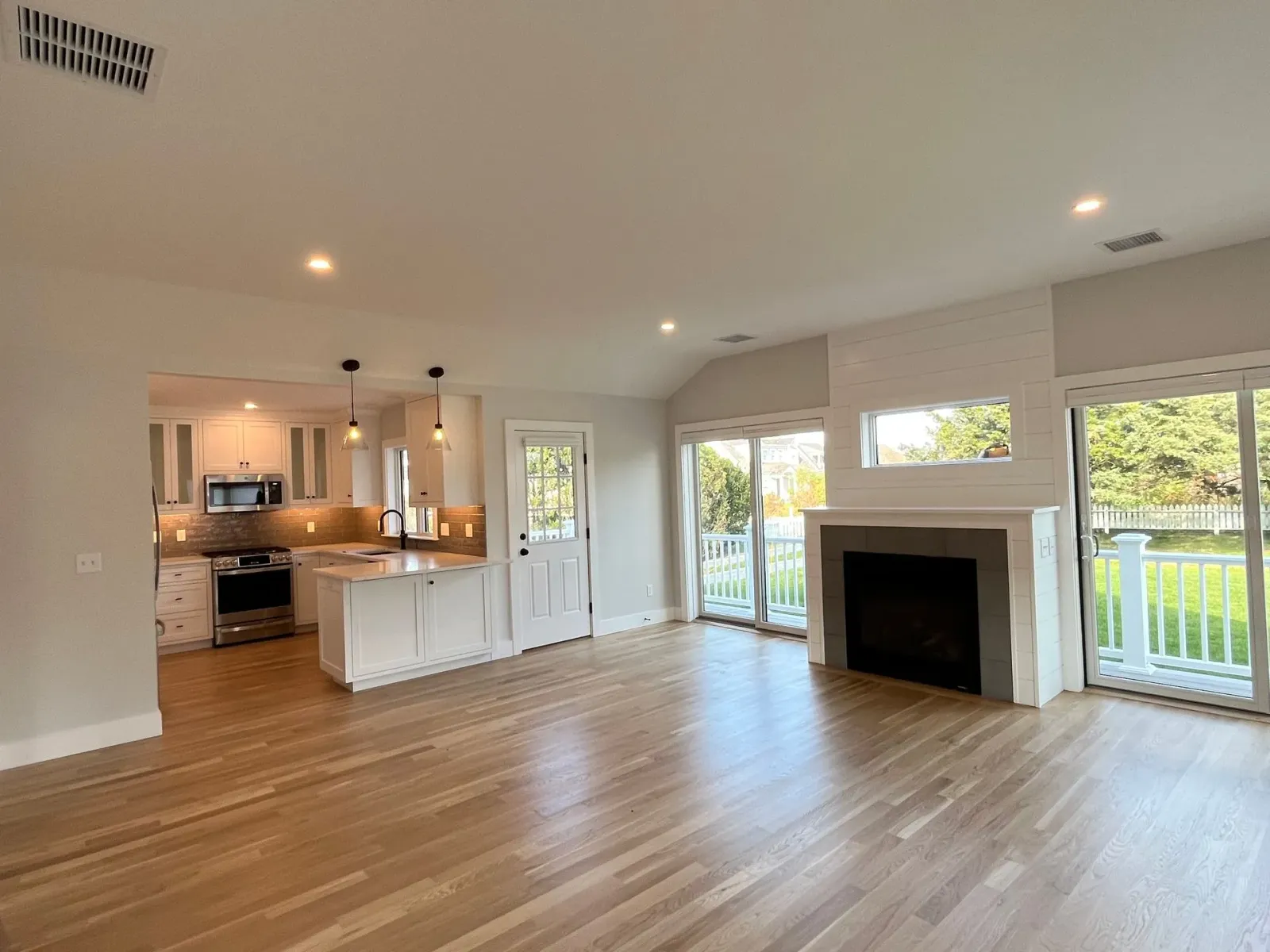 There is a fireplace in the middle of the living room