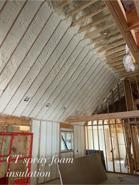 Spray foam insulation on the interior ceiling and walls of a new construction home.