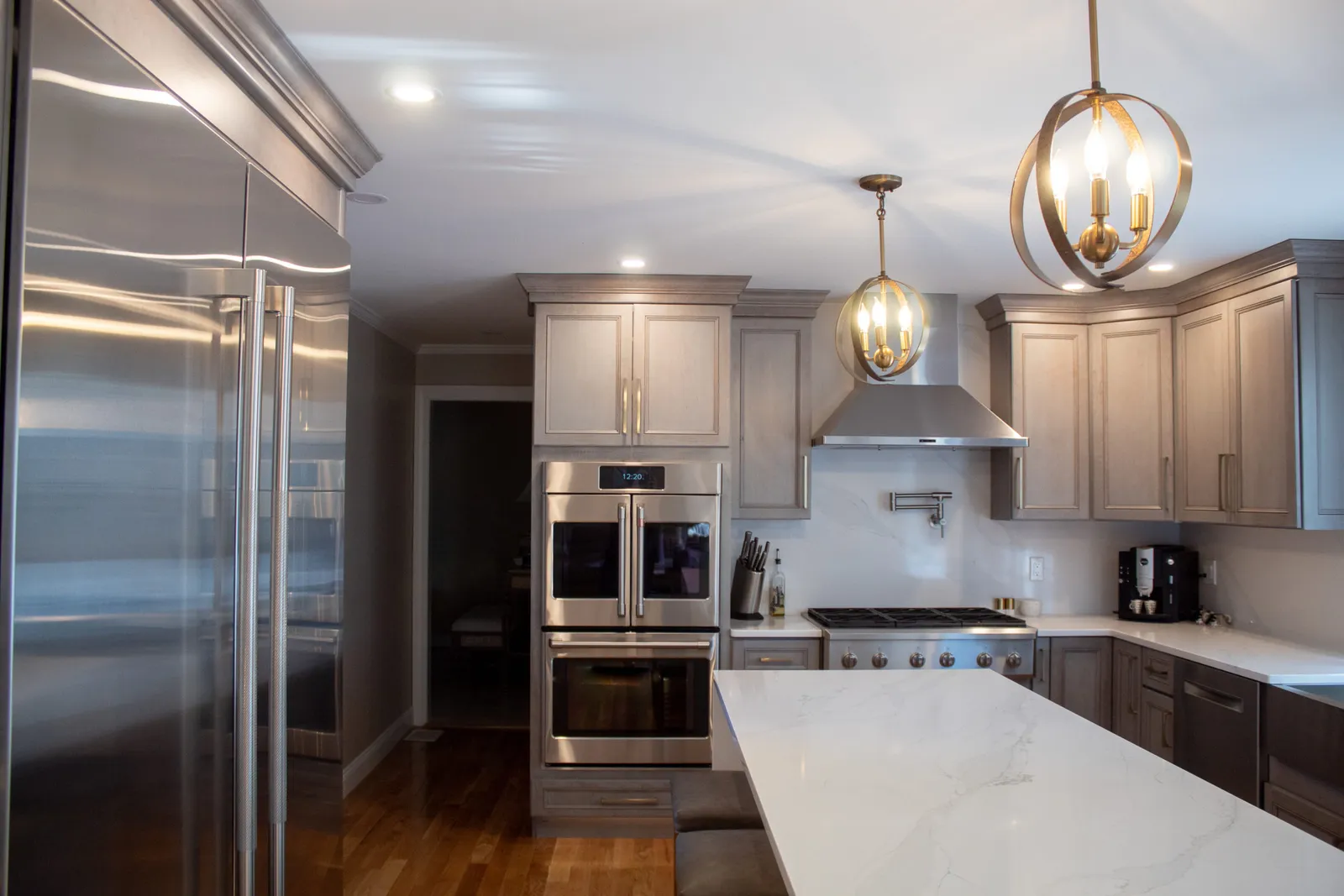 Grey kitchen with panel-ready fridge and quartz island