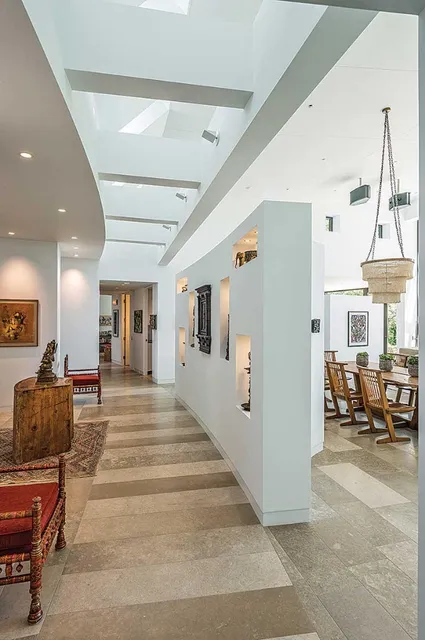 Modern hallway with skylights and open floor plan