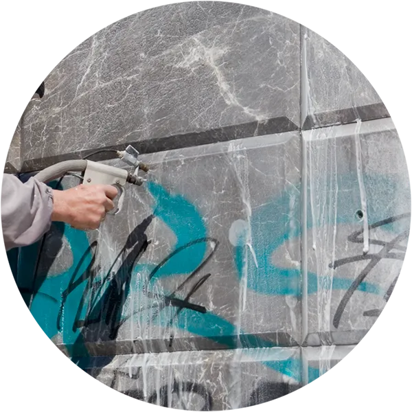 Wall with grafitti gets pressure washed to remove grafitti in Williston, VT