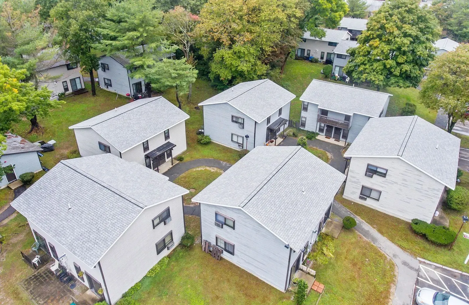 Completed shingle roofs on a multi-building residential property