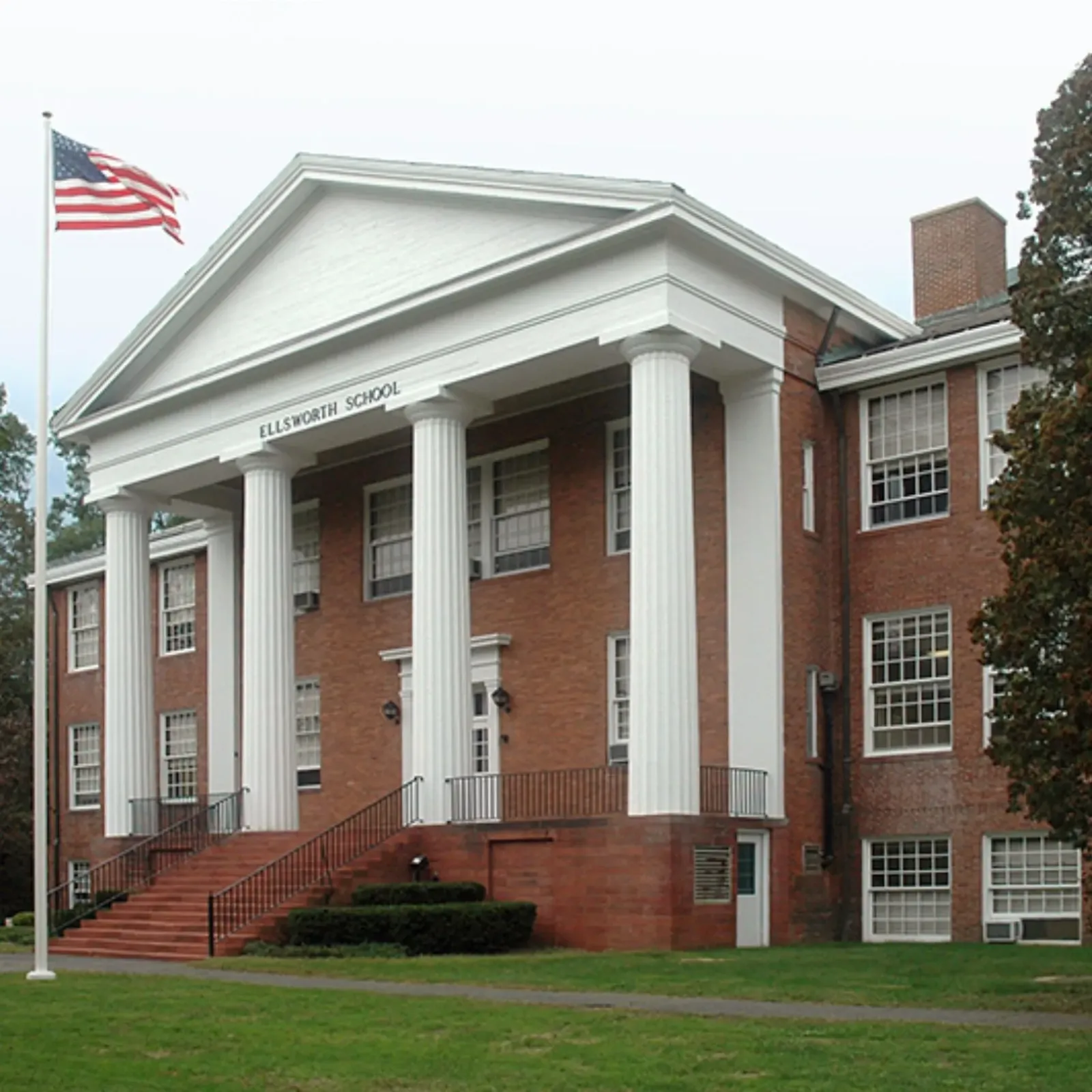 Historic school building restoration by Cenaxo — brick masonry and portico preservation, New England