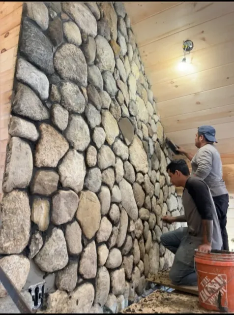 Round stone wall installation
