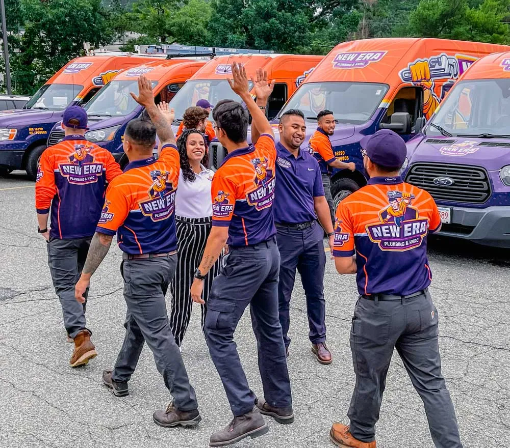New Era's team high five each other at their parking lot