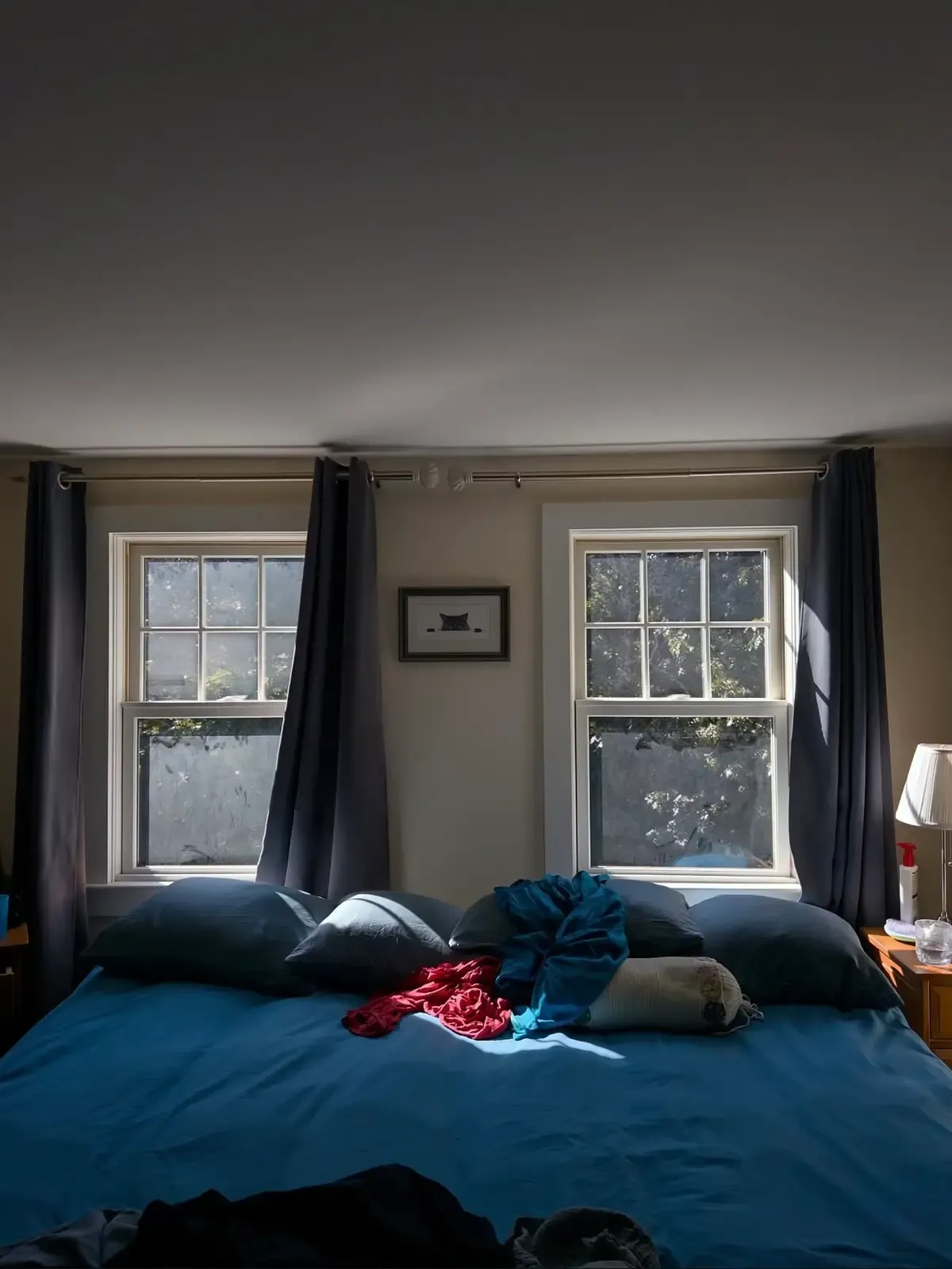 Before photo of a dusty double window in a bedroom