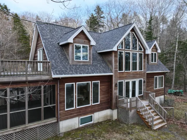Exterior of a modern wooden home with large windows