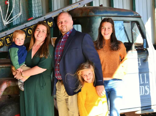 Family photo of Haleigh and Patrick Kelley owners of a house cleaning business called Clean Club Maine