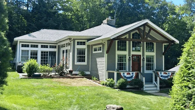 Craftsman style home with new construction roofline