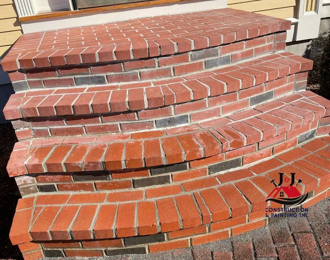 Rebuilt curved brick front steps