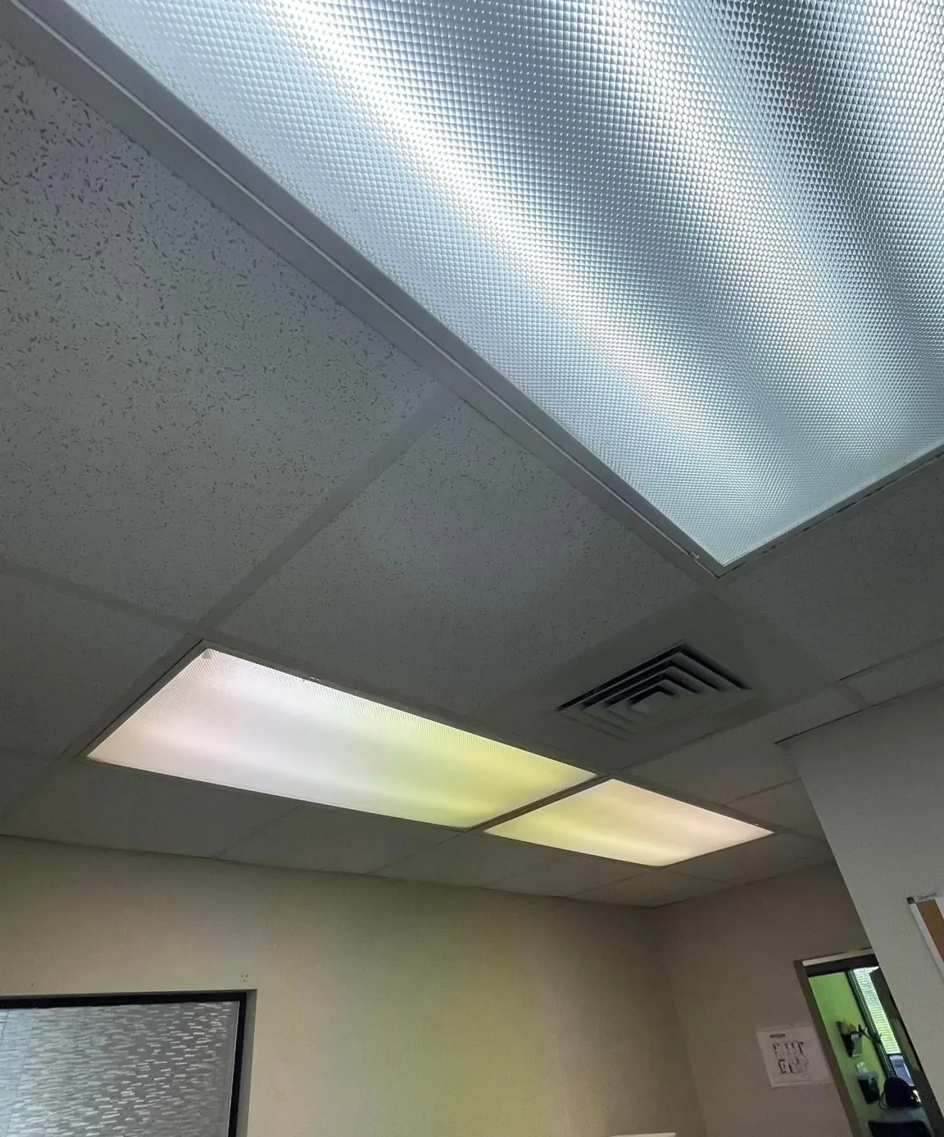 A room with a ceiling that has a lot of lights on it